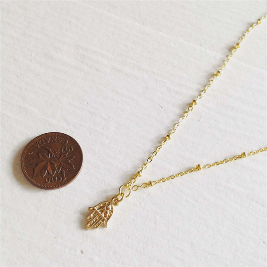 Ankara Tiny Hamsa Charm Necklace in Gold