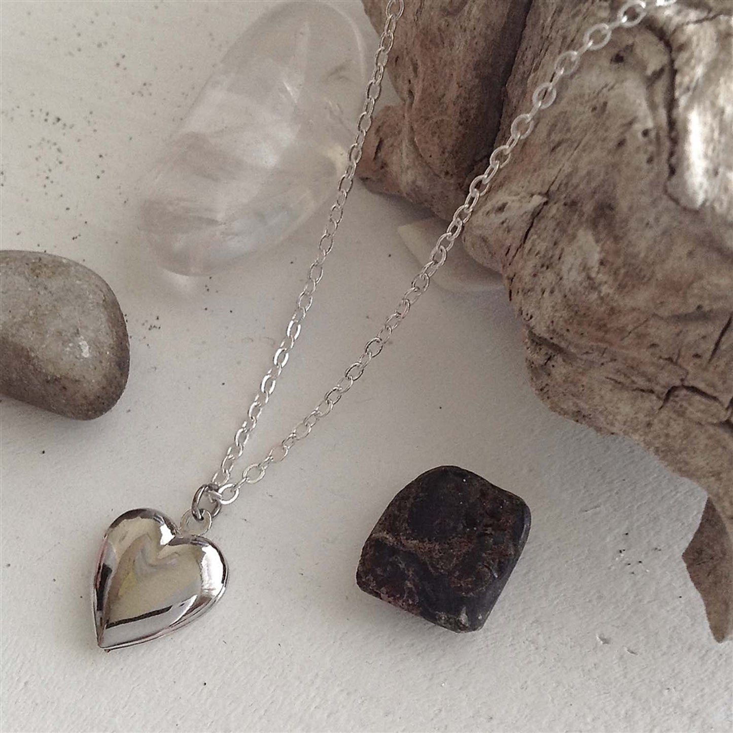 Total Eclipse Tiny Heart Shaped Locket in Silver