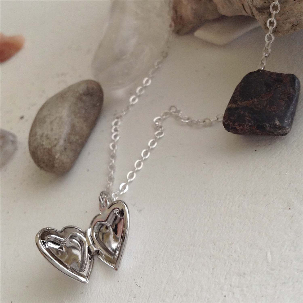 Total Eclipse Tiny Heart Shaped Locket in Silver