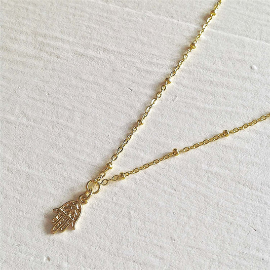 Ankara Tiny Hamsa Charm Necklace in Gold