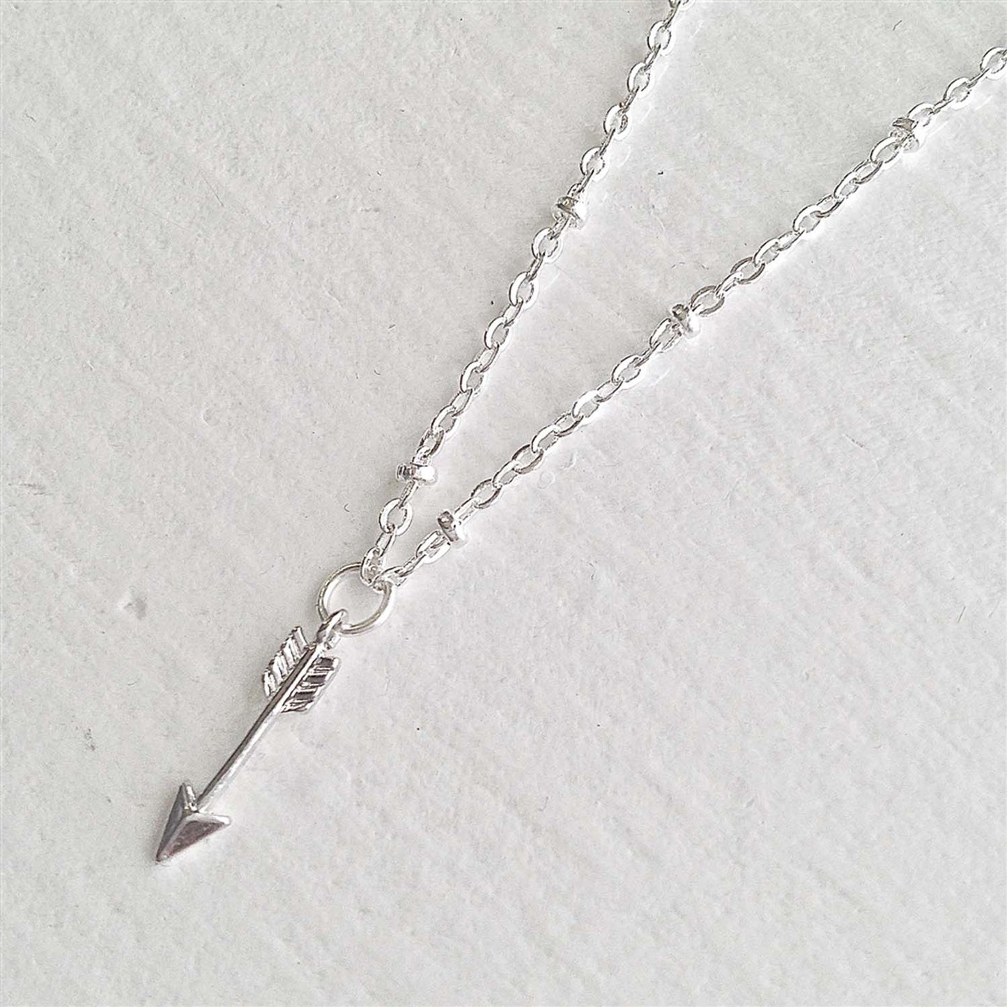 Bullseye Tiny Arrow Charm Necklace in Silver